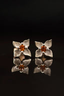 White gold earrings with garnets